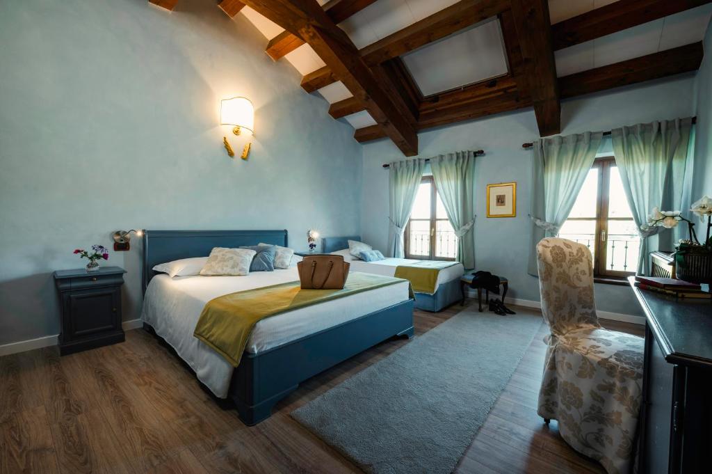Postel nebo postele na pokoji v ubytování La Tavernetta Al Castello