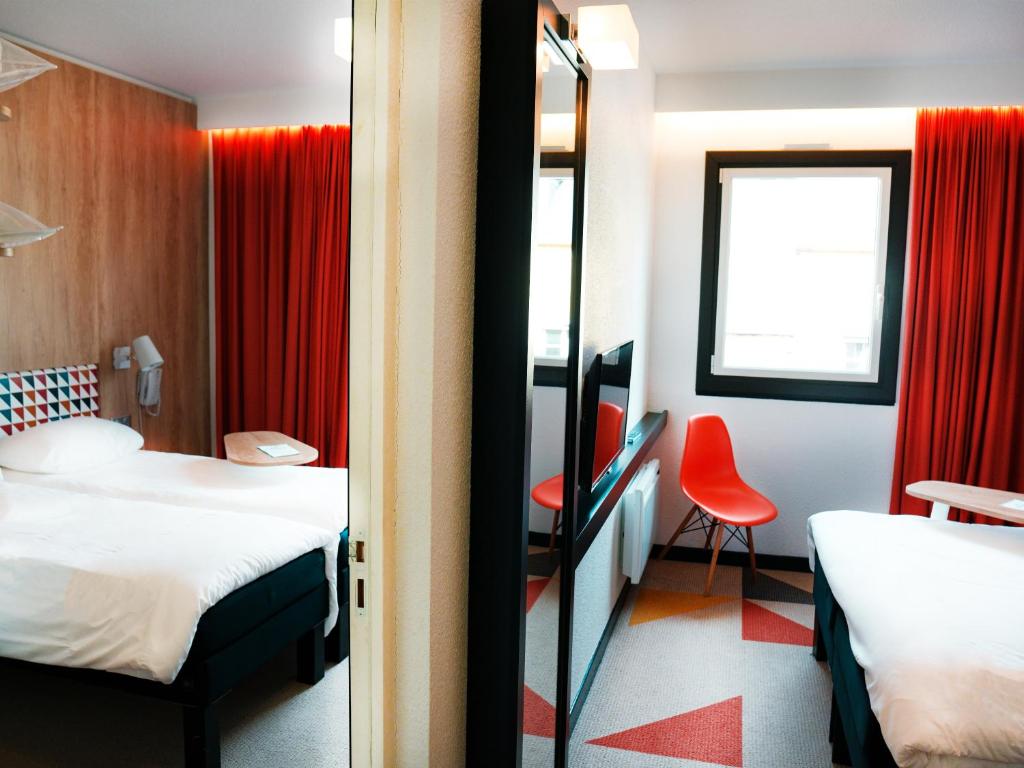 Postel nebo postele na pokoji v ubytování ibis Styles Caen Centre Historique
