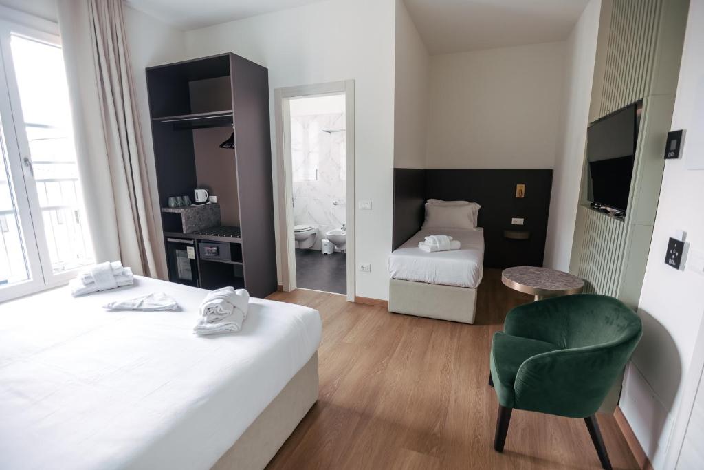 Postel nebo postele na pokoji v ubytování Hotel Arilica