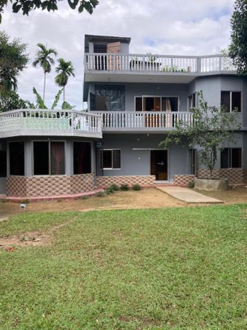 ein großes Haus mit Balkon darüber in der Unterkunft Juri Cottage: Duplex style, Sylhet divison, Bangladesh 