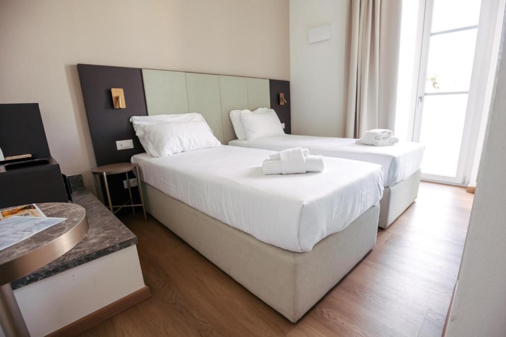 Postel nebo postele na pokoji v ubytování Hotel Arilica