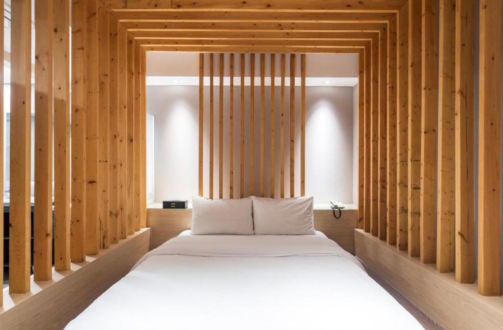 Postel nebo postele na pokoji v ubytování HOTEL MYEONG JAK