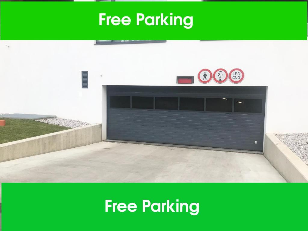 a garage door with two clocks on top of it at Apartmantplus01 in Prague