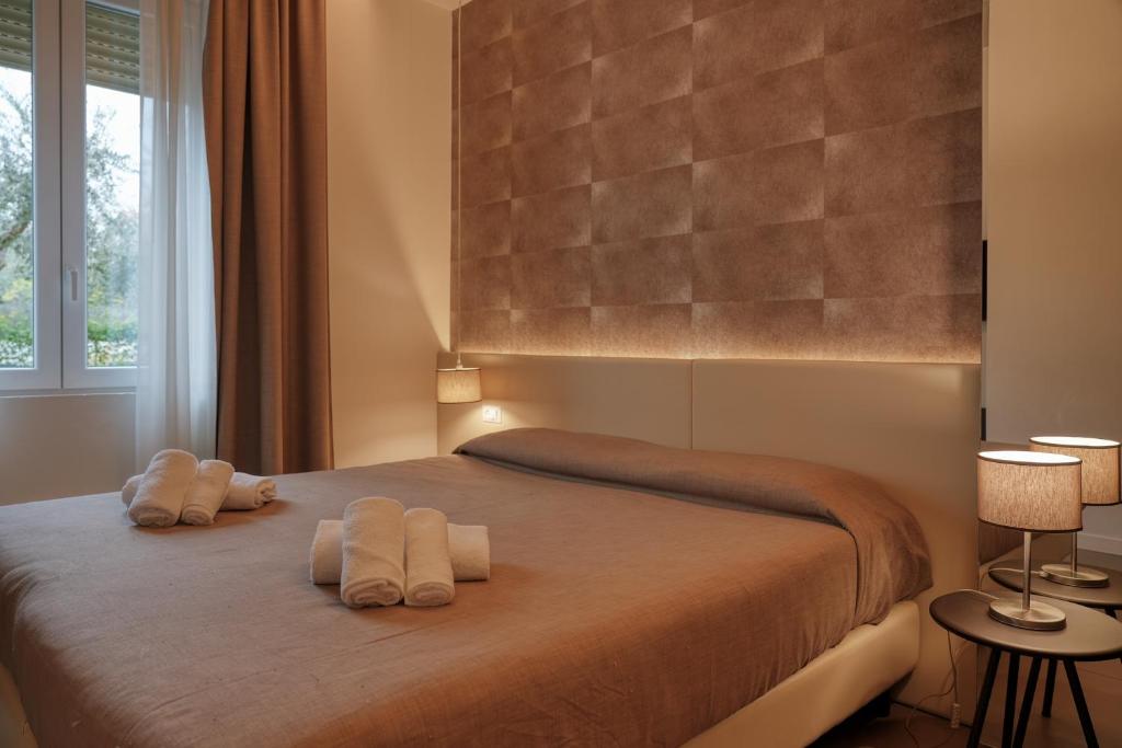Posteľ alebo postele v izbe v ubytovaní Hotel Palazzo del Garda & Spa
