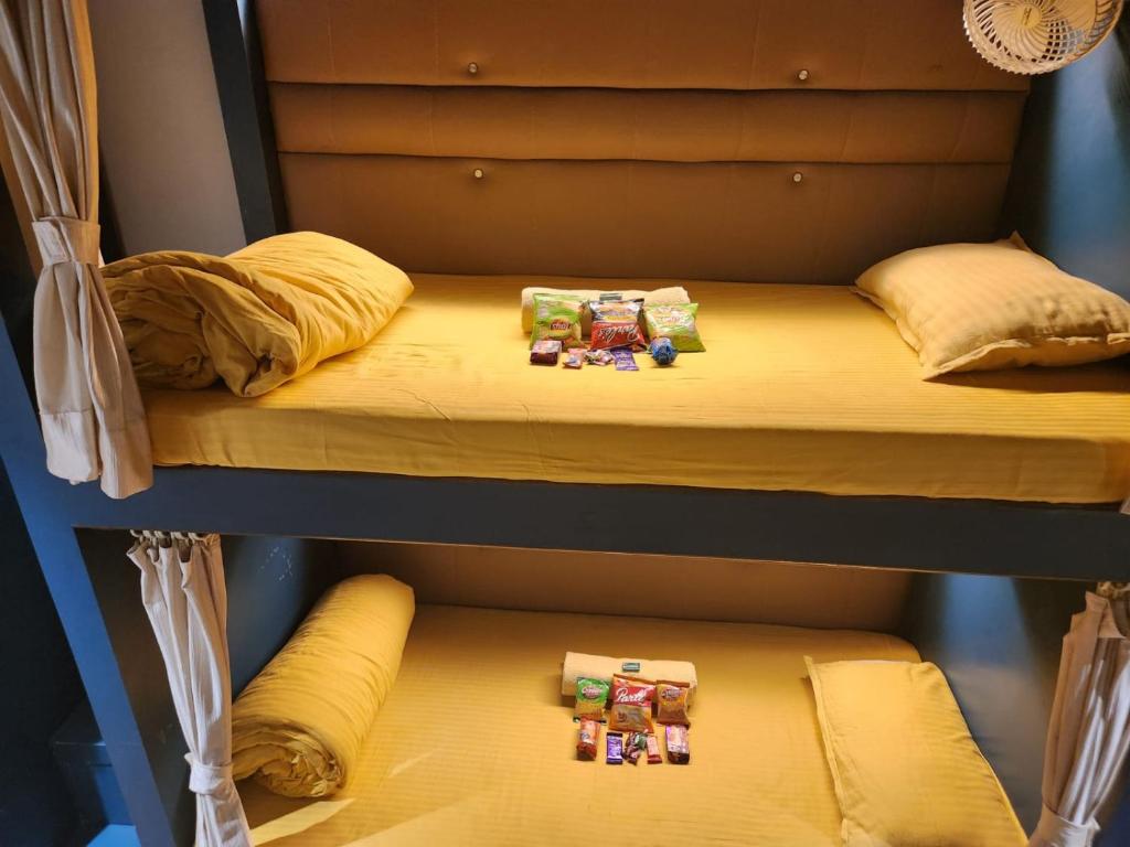 two bunk beds in a room with legos on them at Sinhassan dormitory hostel Juhu in Mumbai