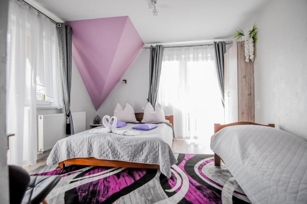 Postel nebo postele na pokoji v ubytování Kukucówka Zakopane
