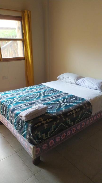 Postel nebo postele na pokoji v ubytování Hotel Palma Coco