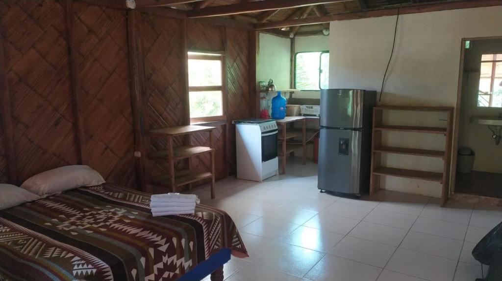 Postel nebo postele na pokoji v ubytování Hotel Palma Coco