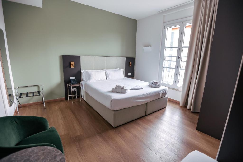 Postel nebo postele na pokoji v ubytování Hotel Arilica