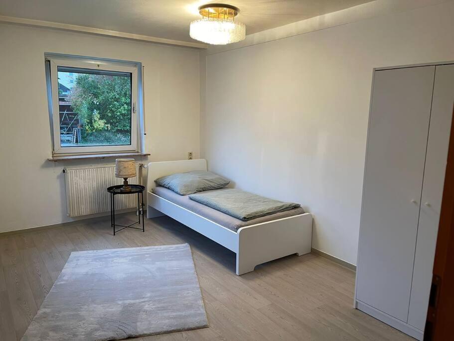 מיטה או מיטות בחדר ב-Ferienhaus, Kassels bester Lage