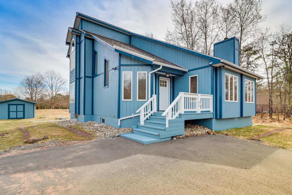 een blauw huis met een trap ervoor bij Albrightsville Retreat with Lake Access! in Albrightsville