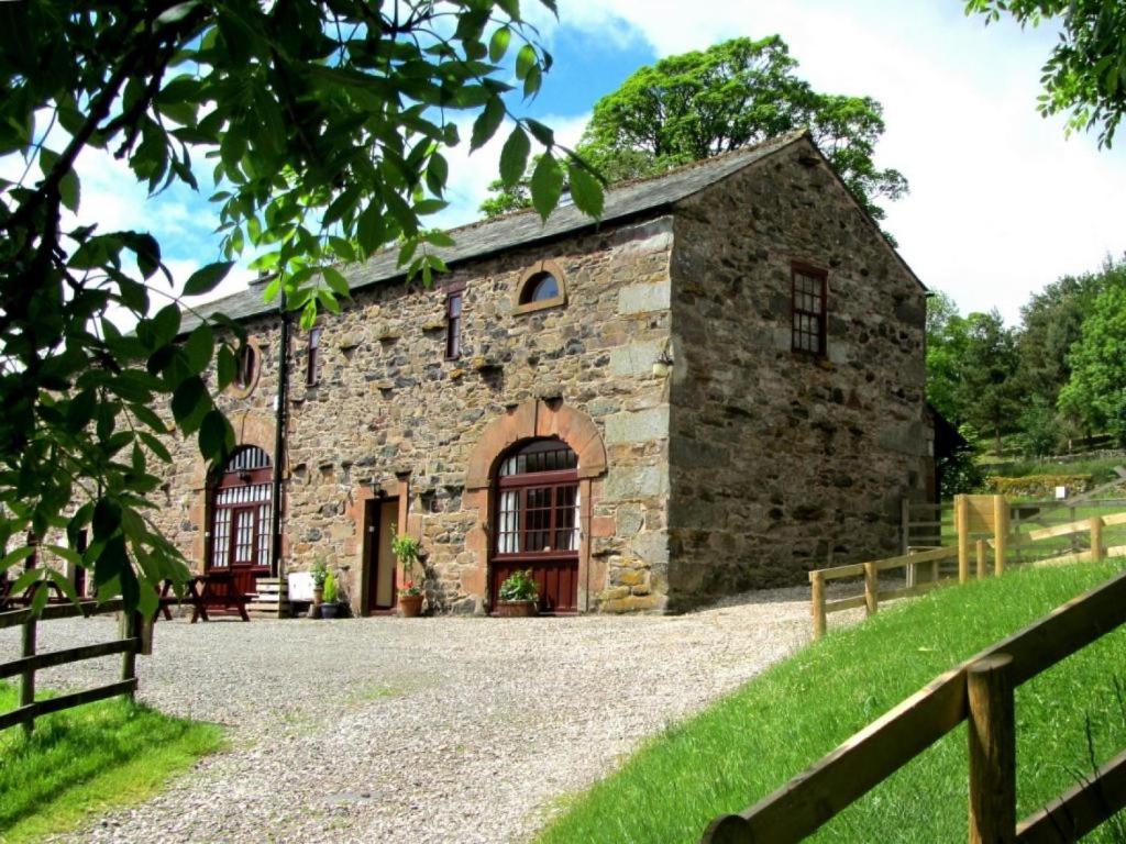 an old stone building with a fence in front of it at 3 Bed in Watermillock SZ318 in Watermillock