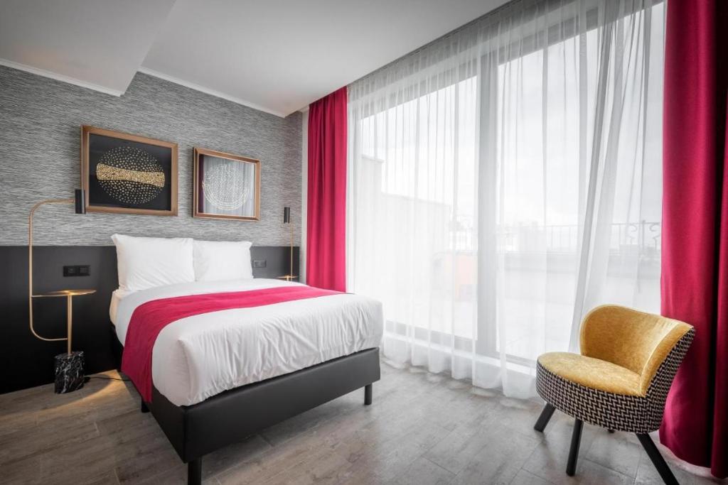 Postel nebo postele na pokoji v ubytování Hotel Jamingo
