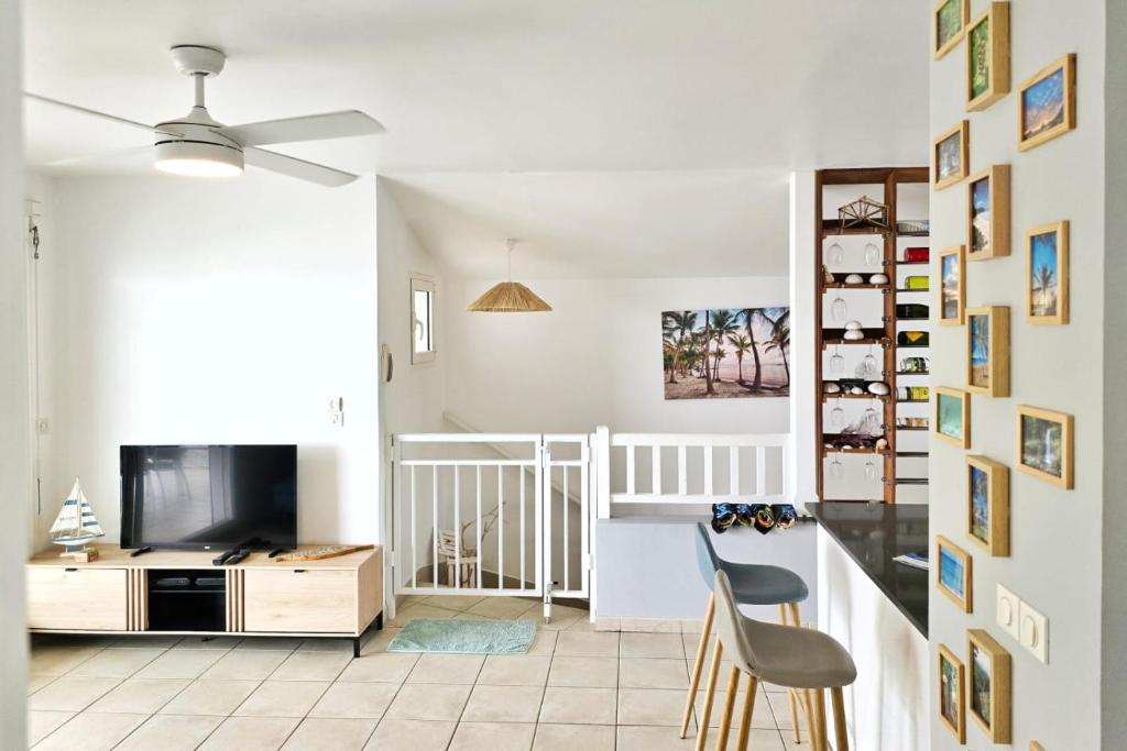 TV a/nebo společenská místnost v ubytování Appartement Carpe Diem