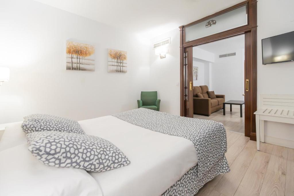 Cama o camas de una habitación en Soho Boutique Los Naranjos