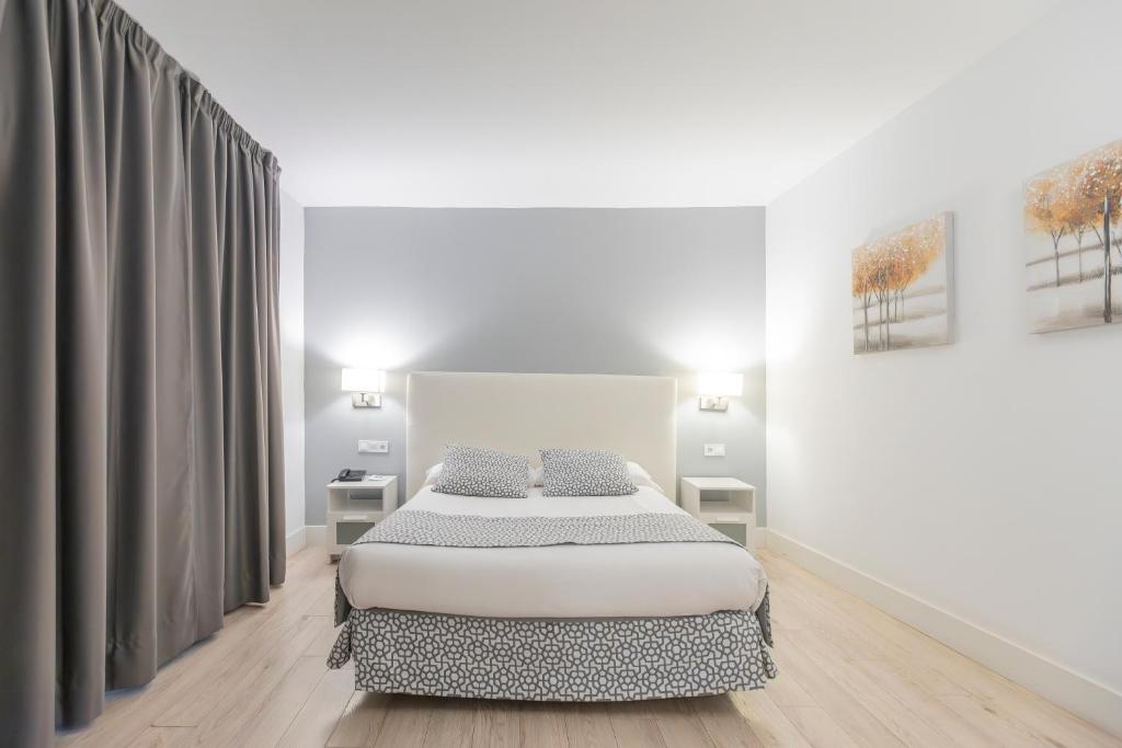 Cama o camas de una habitación en Soho Boutique Los Naranjos