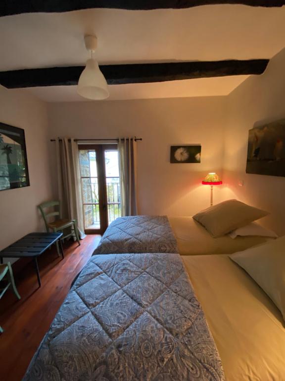Posteľ alebo postele v izbe v ubytovaní Gîte Maison Maitri