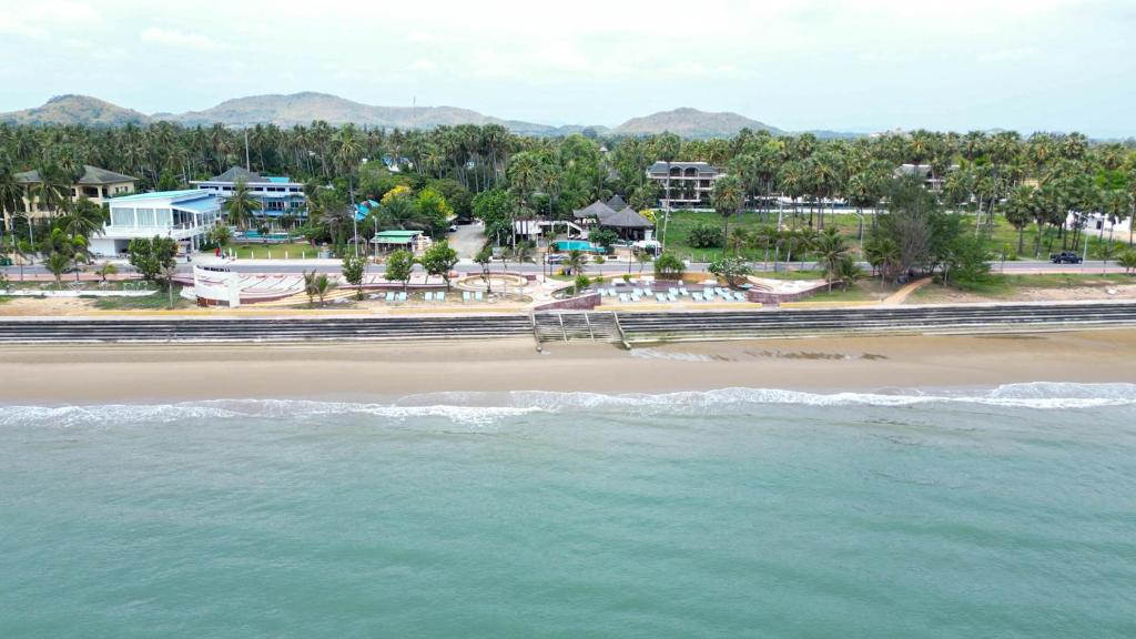 an aerial view of a beach with the ocean at Tanaosri Resort Pranburi in Pran Buri
