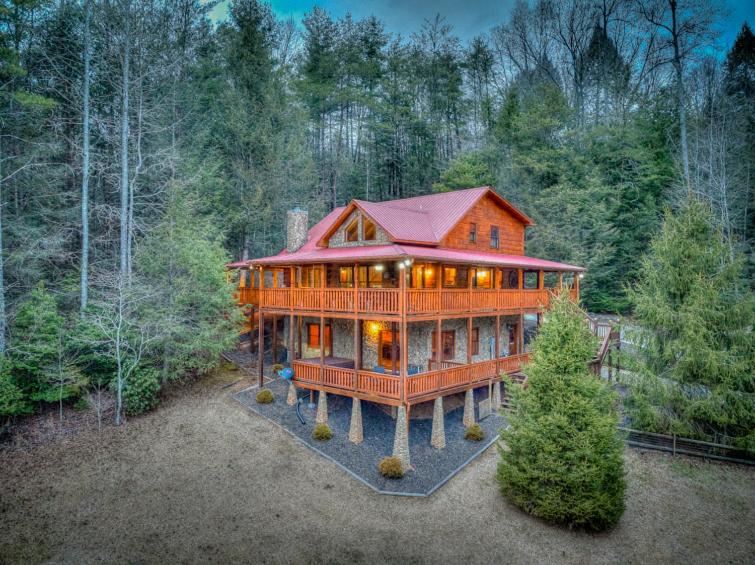 a large wooden house in the middle of a forest at A Family Affair in Blue Ridge