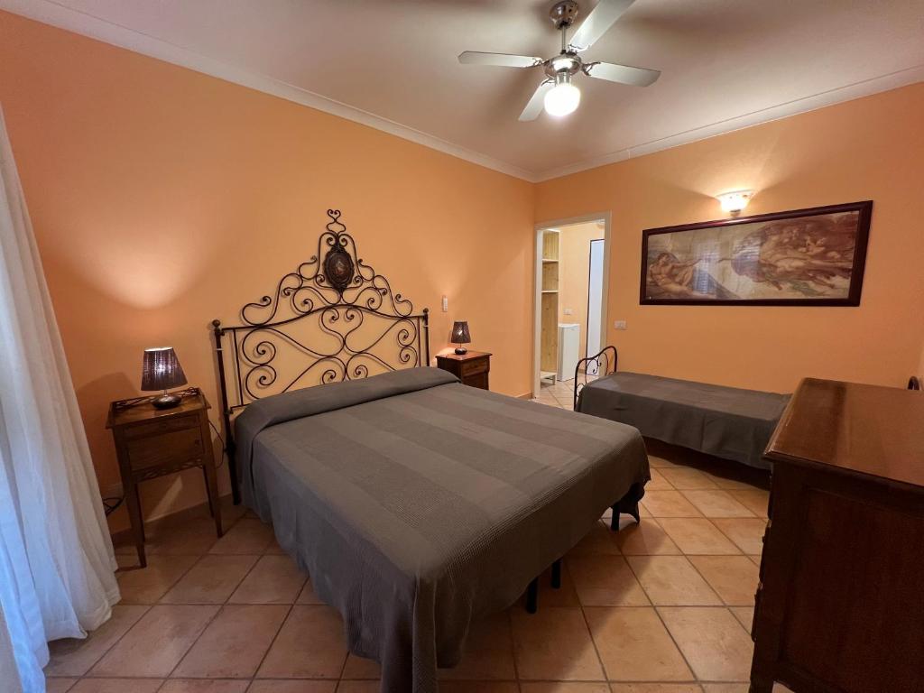 Postel nebo postele na pokoji v ubytování Agriturismo Paradisa