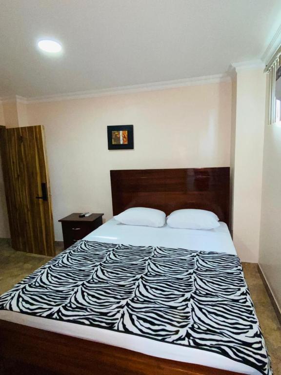 Postel nebo postele na pokoji v ubytování HOTEL MARLUZ