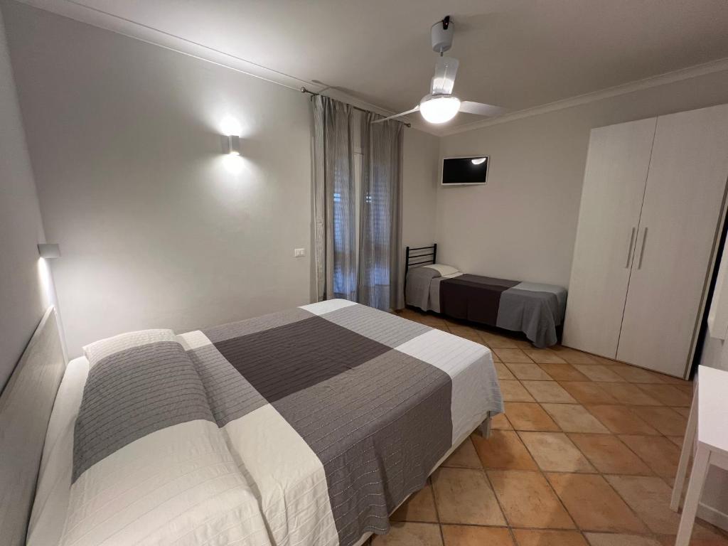 Postel nebo postele na pokoji v ubytování Agriturismo Paradisa