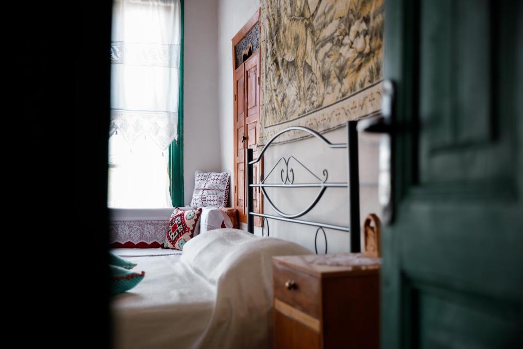 Postel nebo postele na pokoji v ubytování GuestHouse 1805