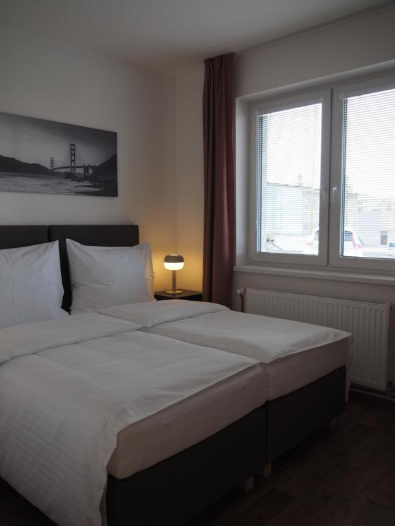 Postel nebo postele na pokoji v ubytování Apartmány Abacie