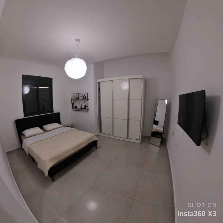 TV a/nebo společenská místnost v ubytování וילת צאלים