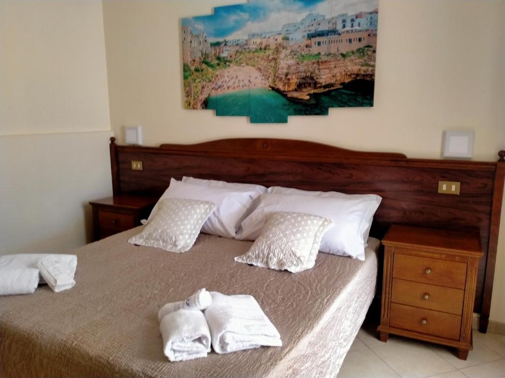 Postel nebo postele na pokoji v ubytování Hotel Grotticelli