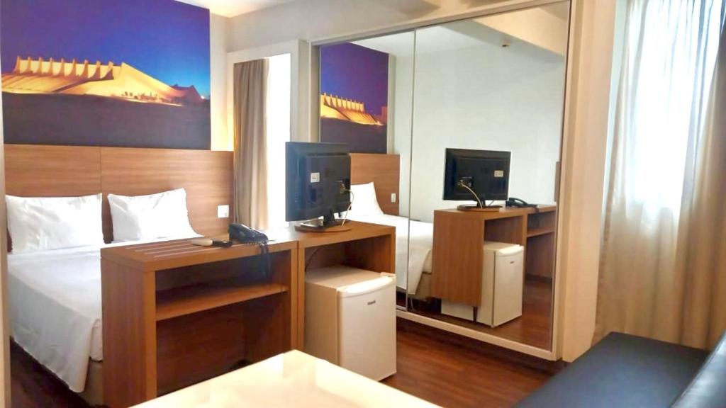 Ένα ή περισσότερα κρεβάτια σε δωμάτιο στο Flat no S4 Hotel em Águas Claras