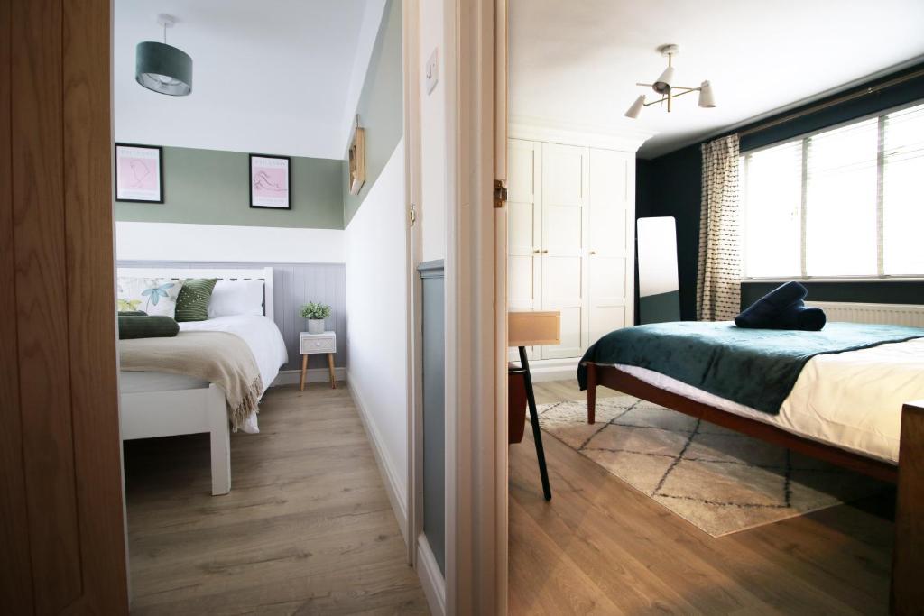 a bedroom with a bed and a window at Countryside Gem - Tranquil Escape in Bath in Bath