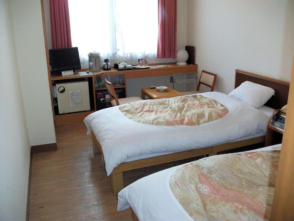 Postel nebo postele na pokoji v ubytování Mt Fuji Hanayagi no Sho Keizan