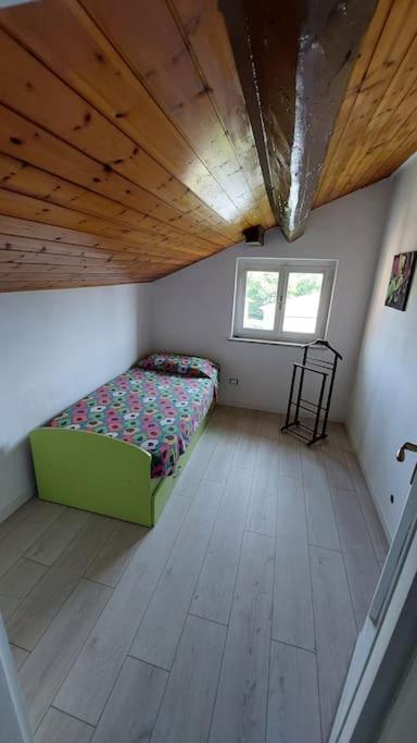 Postel nebo postele na pokoji v ubytování Comodo, pratico e tranquillo