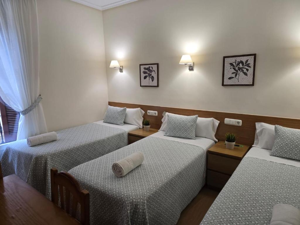 Cama o camas de una habitación en Pensión San Jerónimo