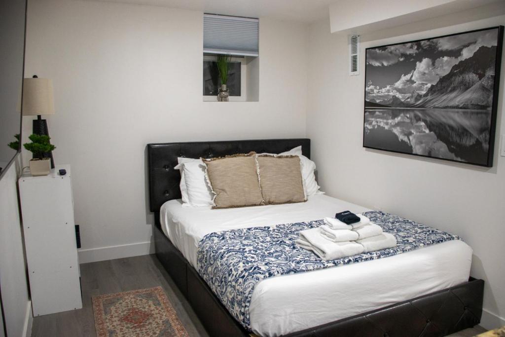 a bedroom with a bed with towels on it at Silver Studio in Salt Lake City