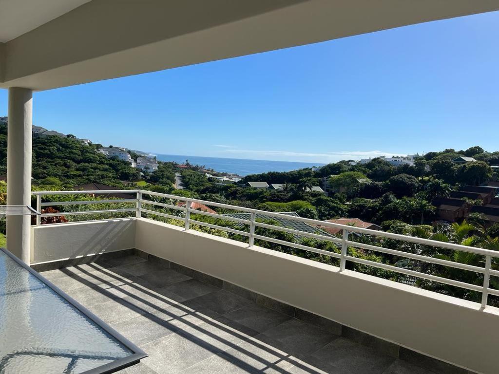 a balcony of a house with a view of the ocean at 22 Lands End in Ballito