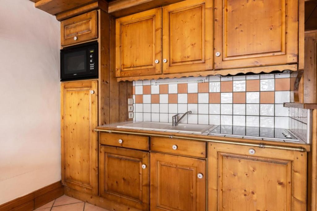 Kuchyňa alebo kuchynka v ubytovaní Résidence Les Alpages de Chantel - maeva Home - Appartement 3 Pièces 6 Personnes - Sélection MAE-1652