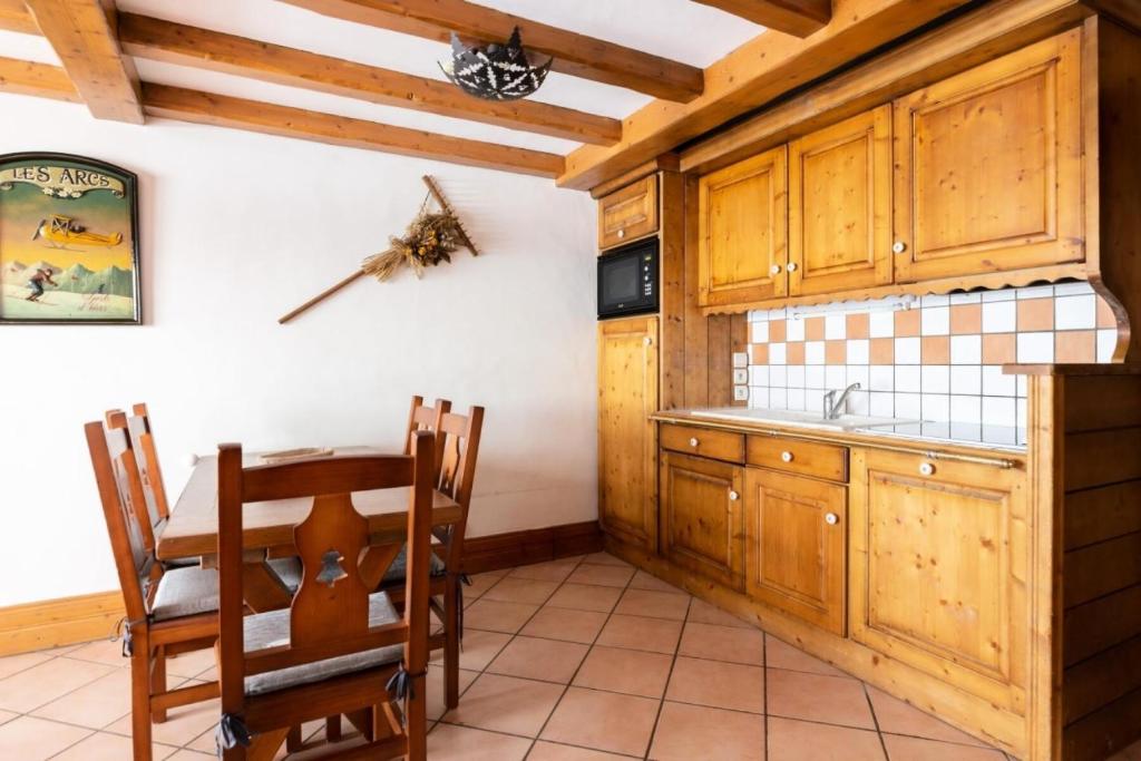 Kuchyňa alebo kuchynka v ubytovaní Résidence Les Alpages de Chantel - maeva Home - Appartement 3 Pièces 6 Personnes - Sélection MAE-1652