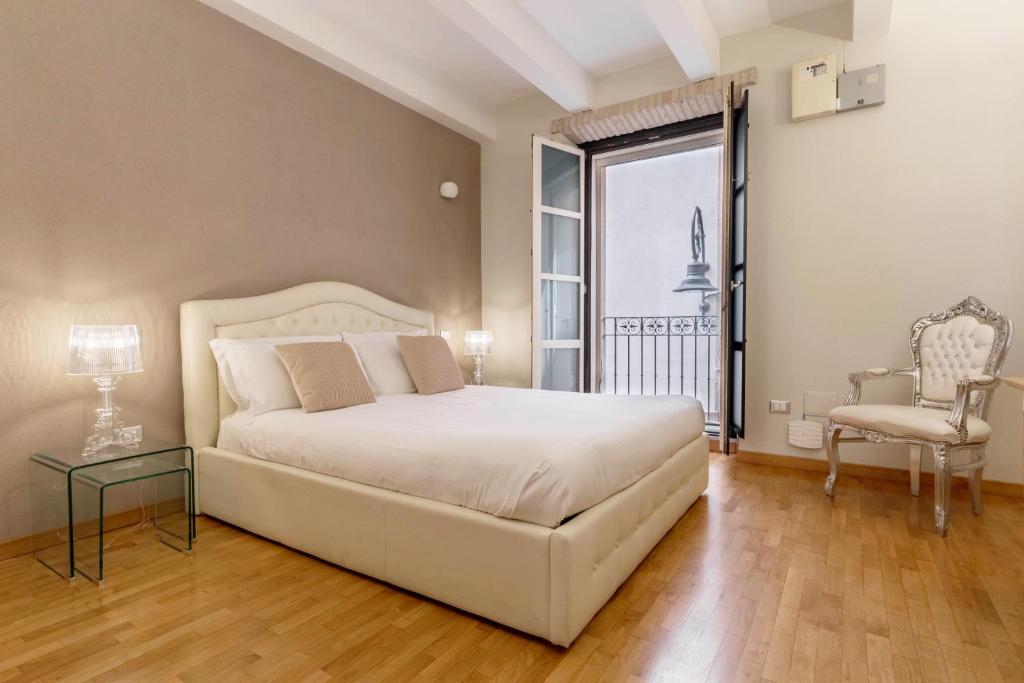 Кровать или кровати в номере Martini Rooms Castello