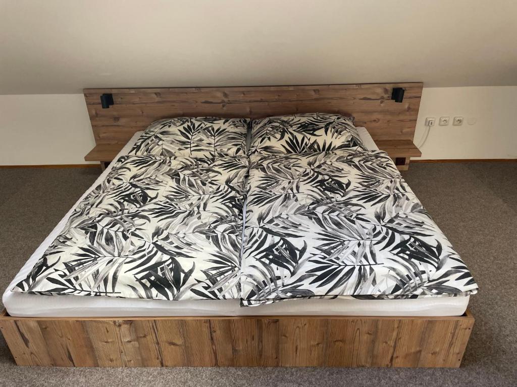 Postel nebo postele na pokoji v ubytování Apartmán pod Kňeží Horou