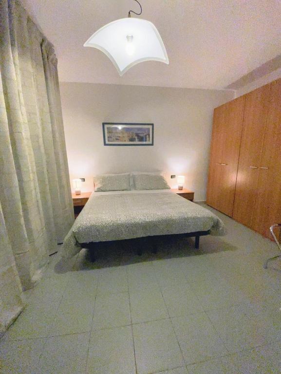 Postel nebo postele na pokoji v ubytování Le Sorbole