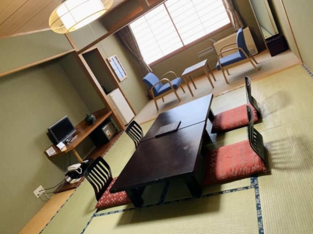 an overhead view of a living room with a table and chairs at Mount View Hotel - Vacation STAY 40105v in Kamikawa