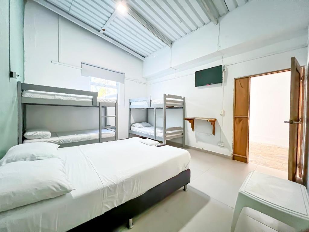 Voodi või voodid majutusasutuse Hotel Palma Grande by Stanza toas