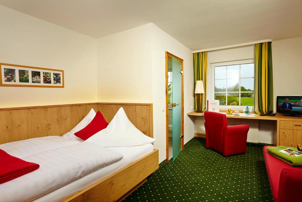 TV a/nebo společenská místnost v ubytování Hotel Waldhaus Föckinghausen