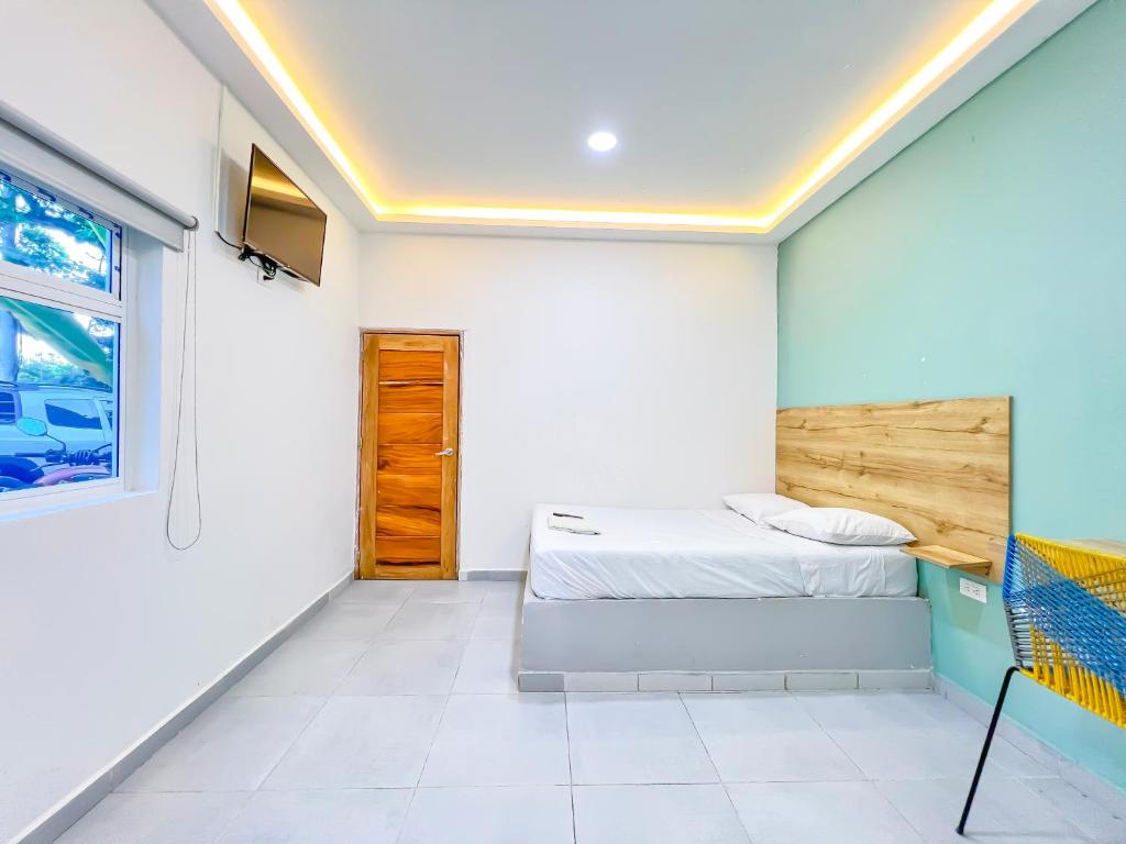 Voodi või voodid majutusasutuse Hotel Palma Grande by Stanza toas