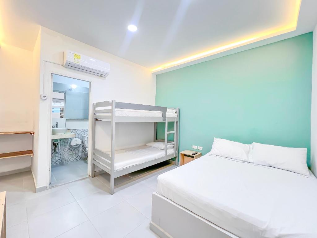 Voodi või voodid majutusasutuse Hotel Palma Grande by Stanza toas