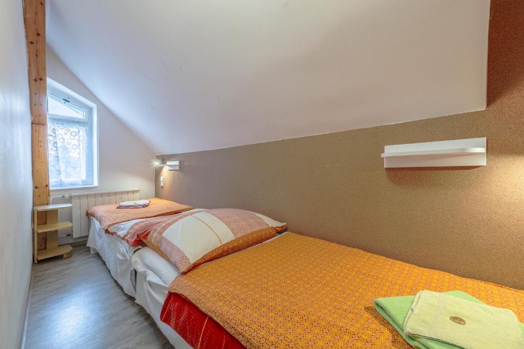 Postel nebo postele na pokoji v ubytování Penzion Pokorny