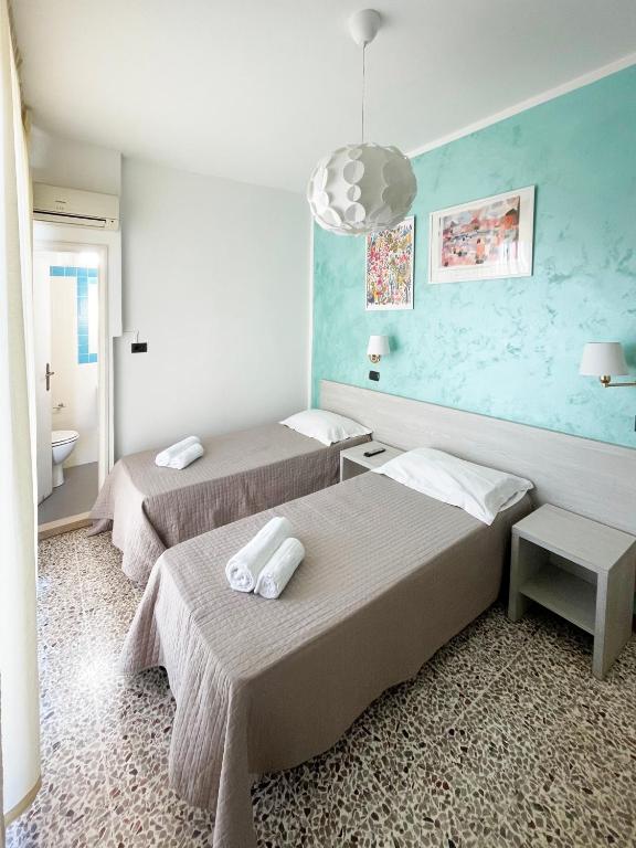 Postel nebo postele na pokoji v ubytování Hotel Reale