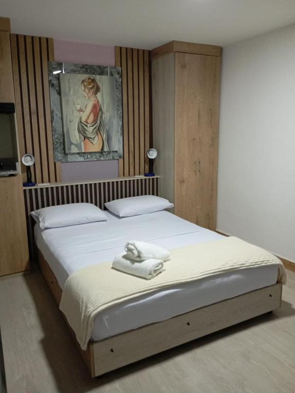 Postel nebo postele na pokoji v ubytování Hotel Lares 70 Laureles